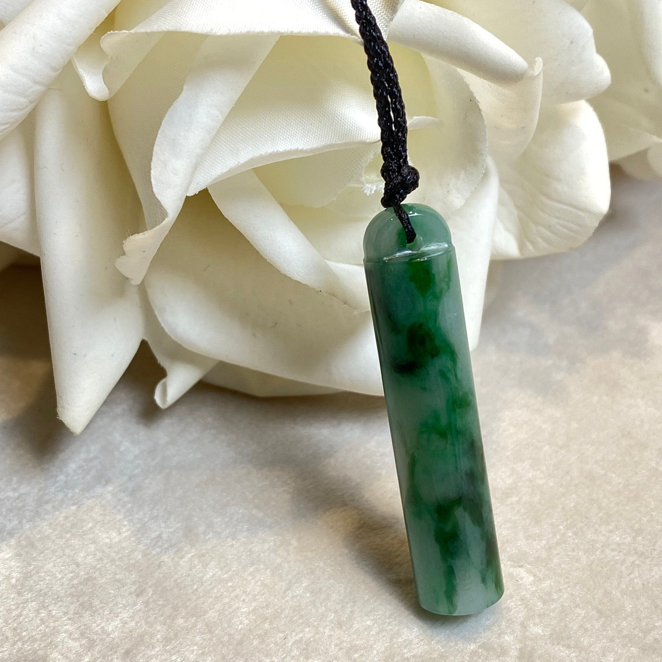 An Exceptional Carved Jadeite Lingguan Tube Pendant Necklace