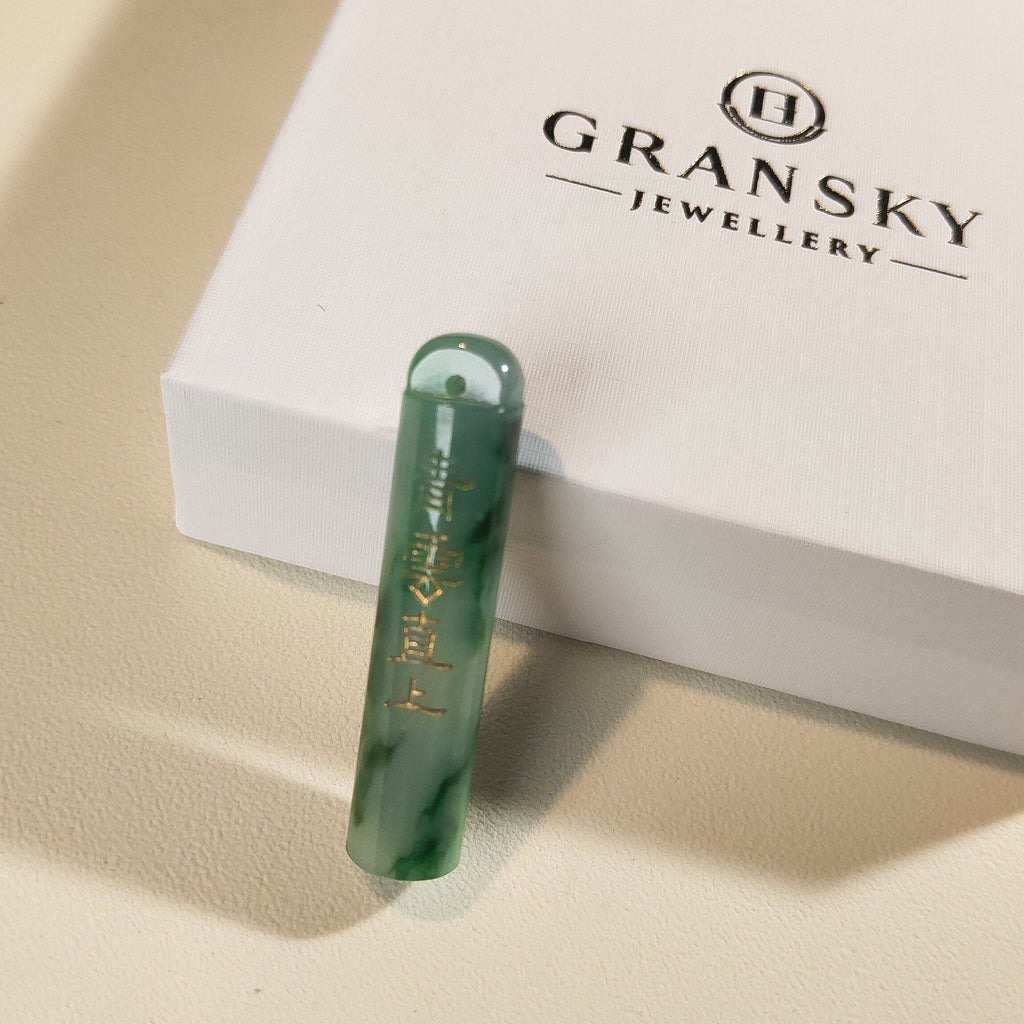 An Exceptional Carved Jadeite Lingguan Tube Pendant Necklace