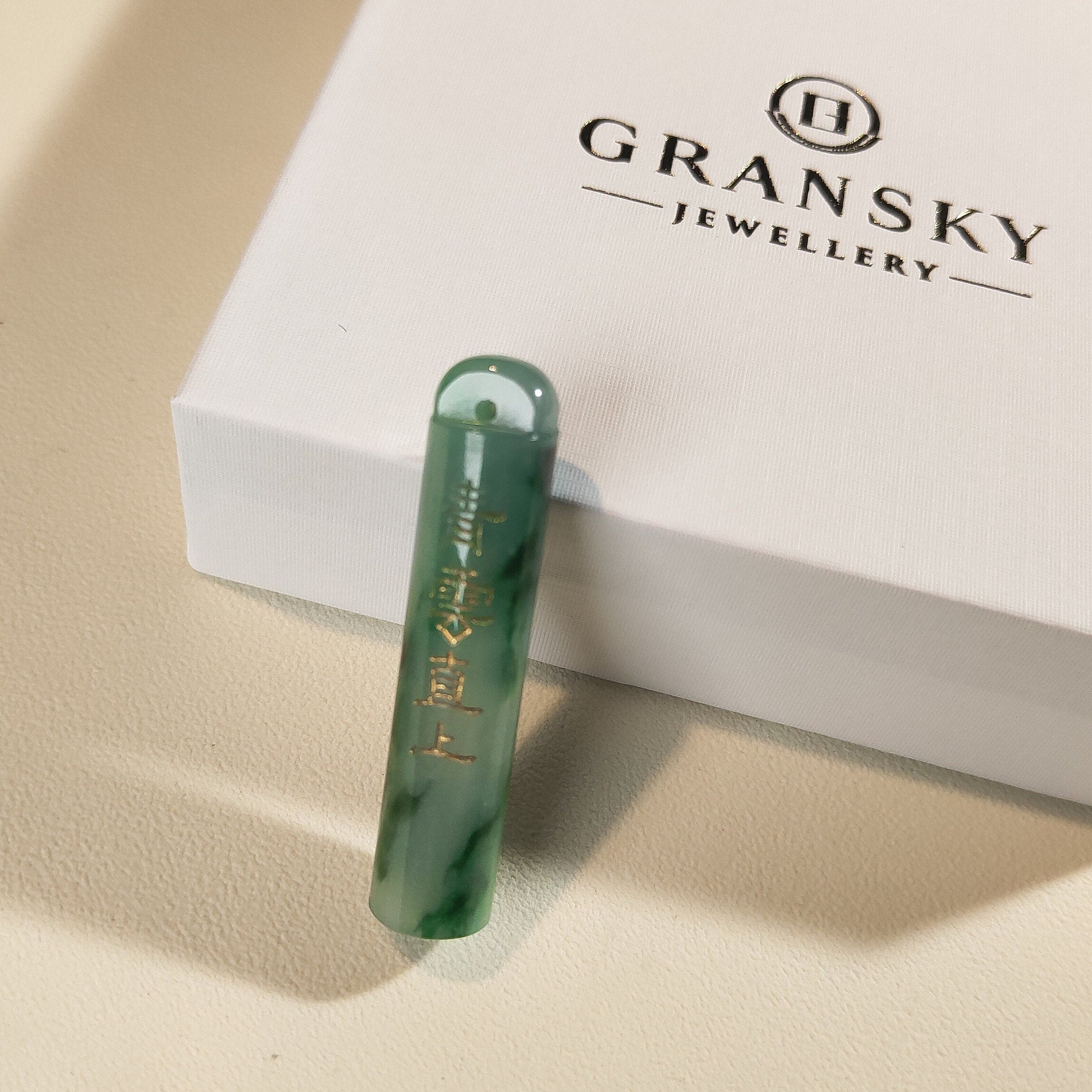 An Exceptional Carved Jadeite Lingguan Tube Pendant Necklace