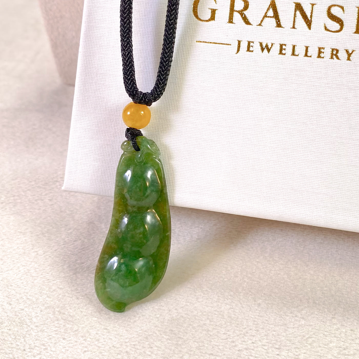 Handcrafted Peapod-Shaped Green Jade Pendant with Orange Bead
