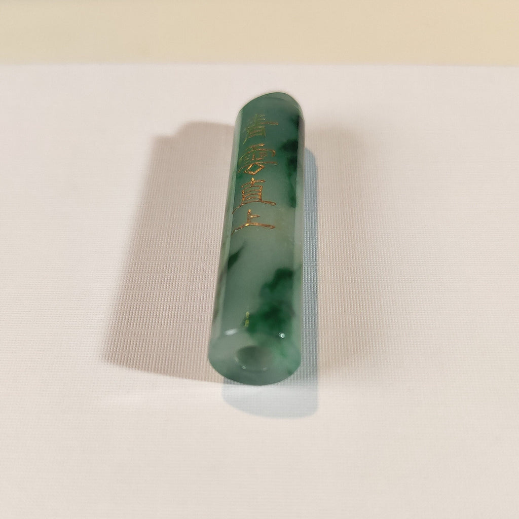 An Exceptional Carved Jadeite Lingguan Tube Pendant Necklace