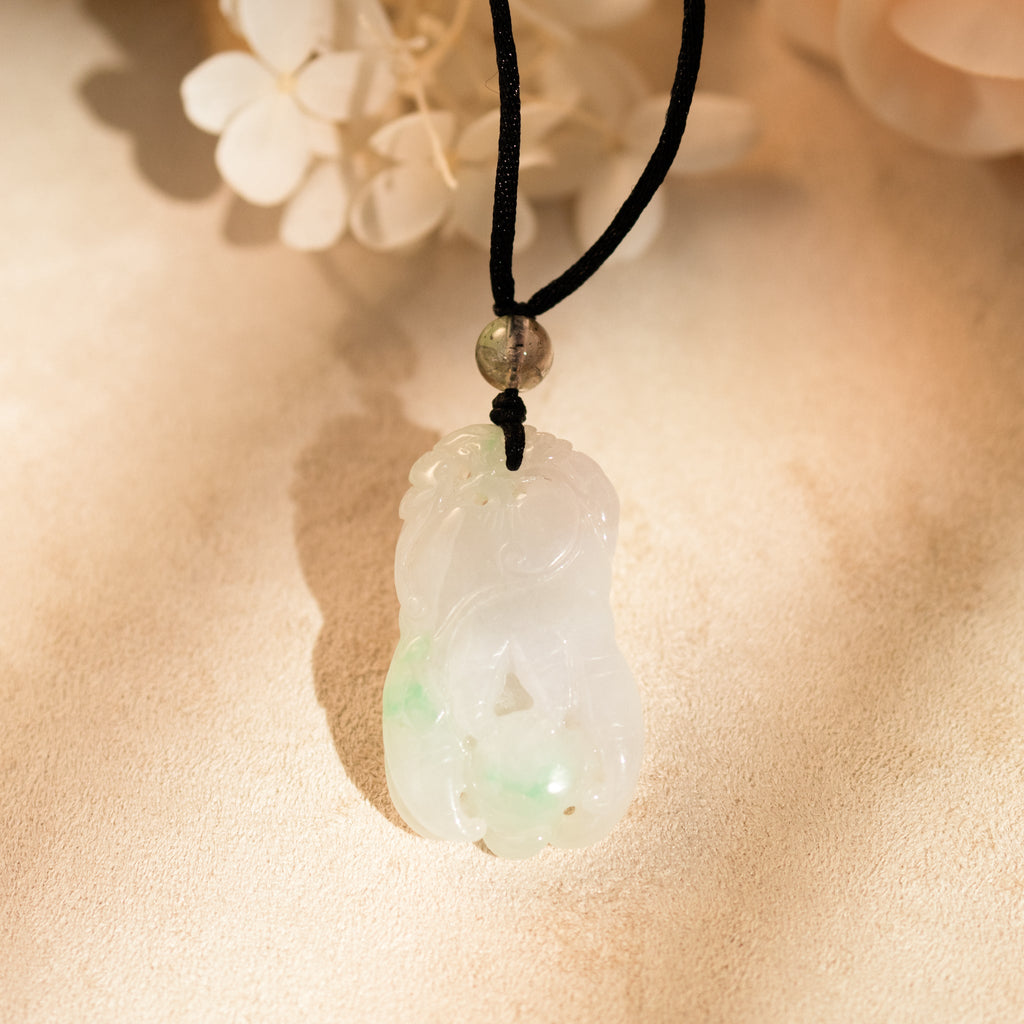 Purple and Green Jade Buddha Hand Pendant with Mudra Symbolism