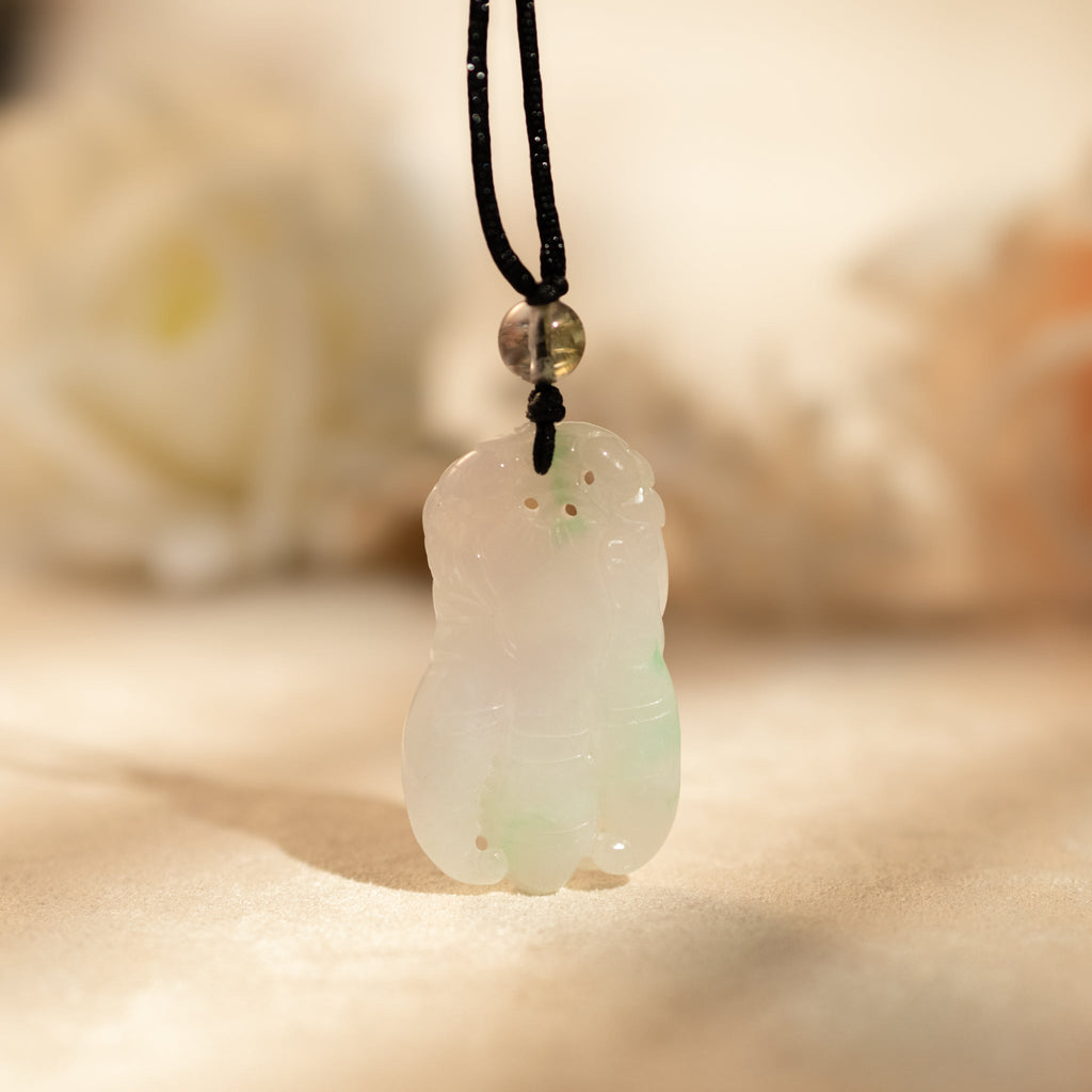 Purple and Green Jade Buddha Hand Pendant with Mudra Symbolism