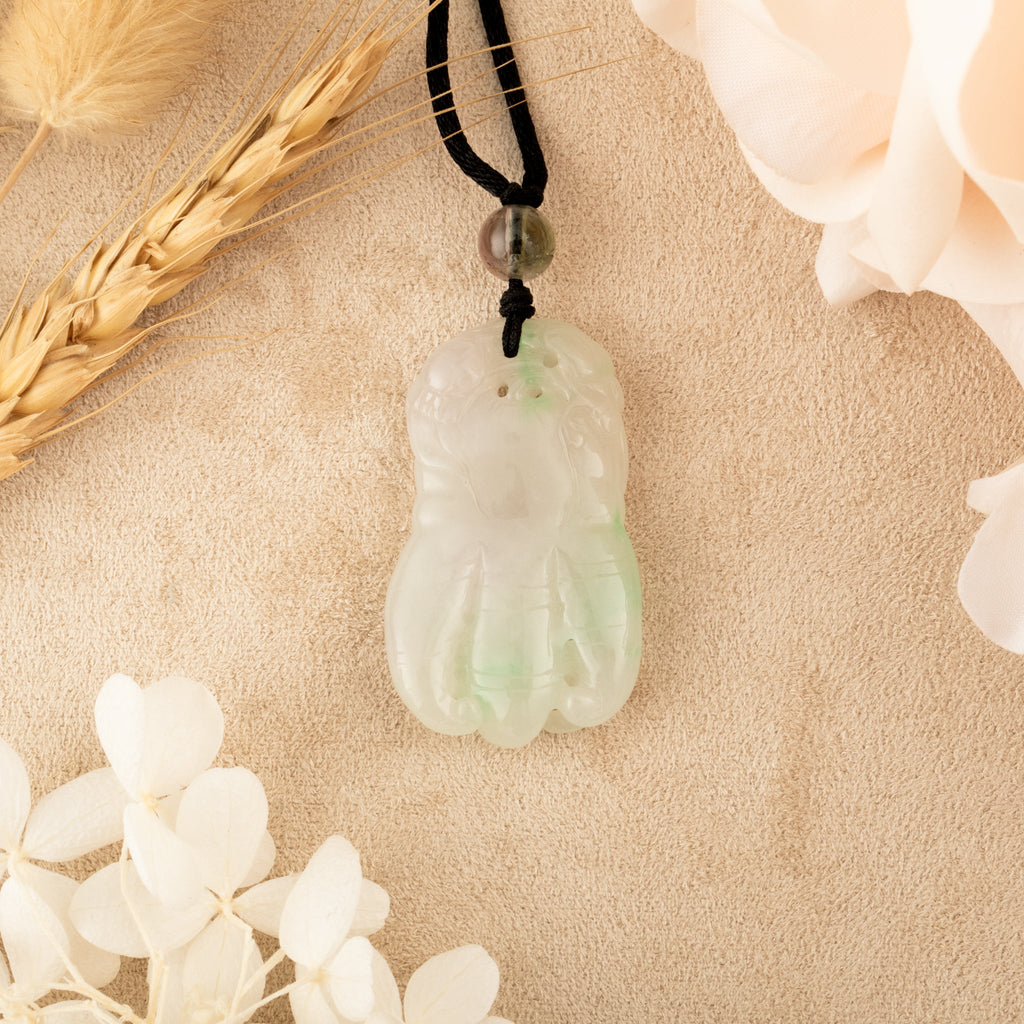 Purple and Green Jade Buddha Hand Pendant with Mudra Symbolism