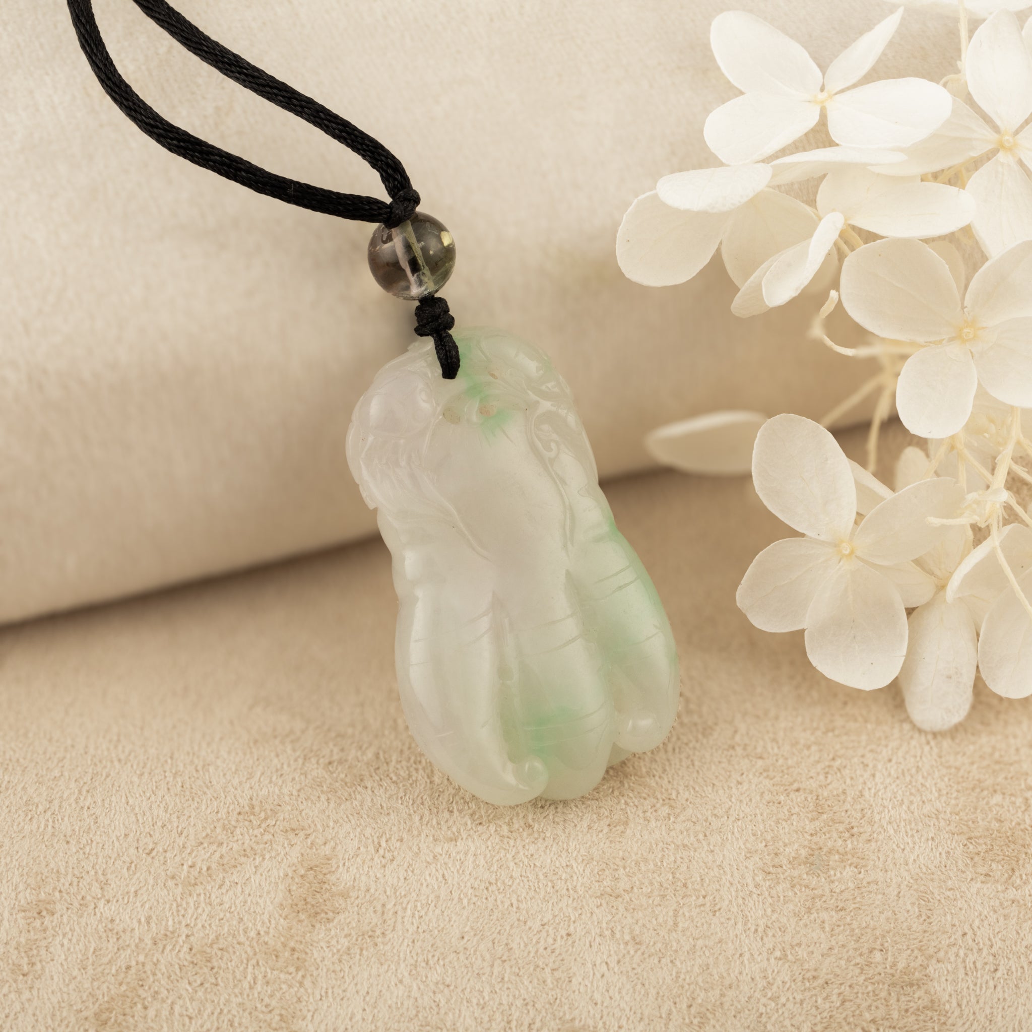 Purple and Green Jade Buddha Hand Pendant with Mudra Symbolism