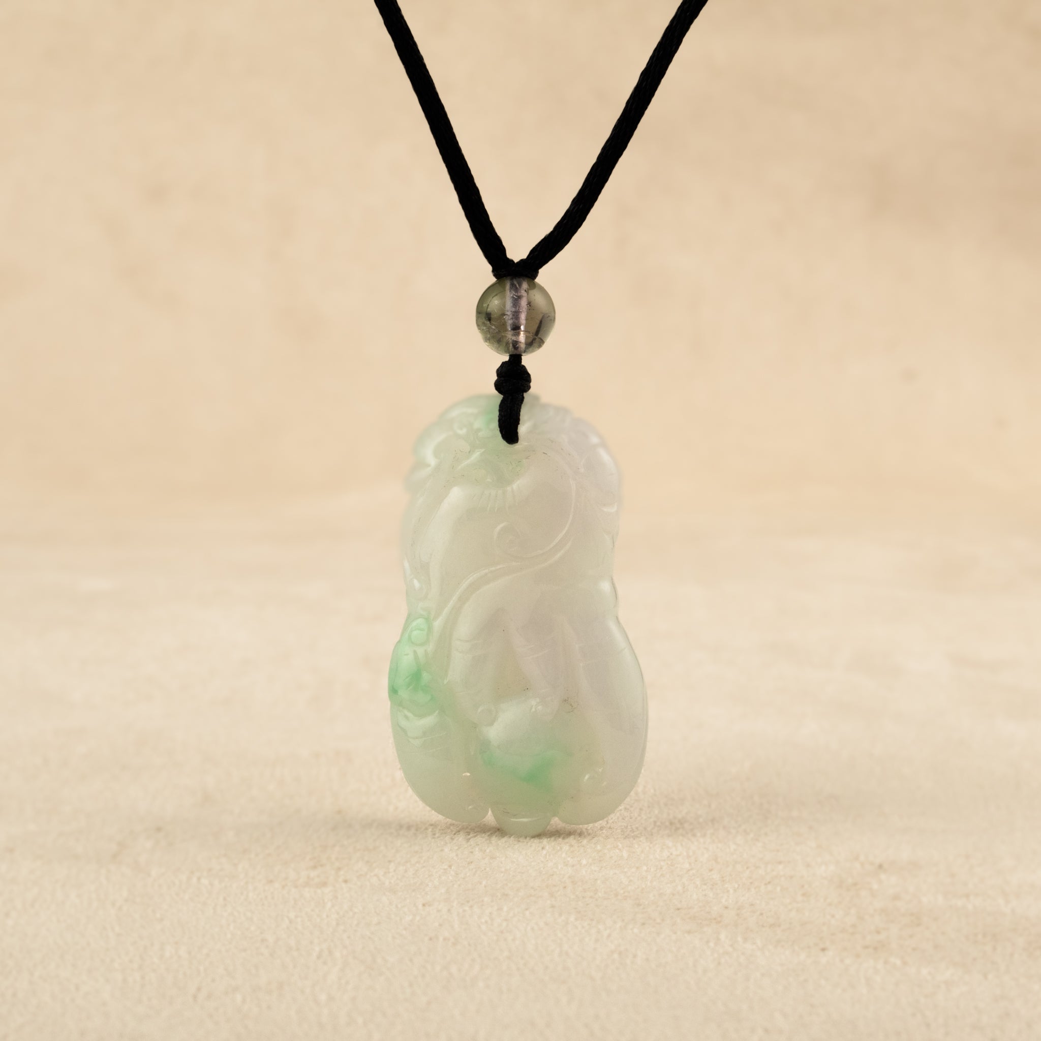 Purple and Green Jade Buddha Hand Pendant with Mudra Symbolism